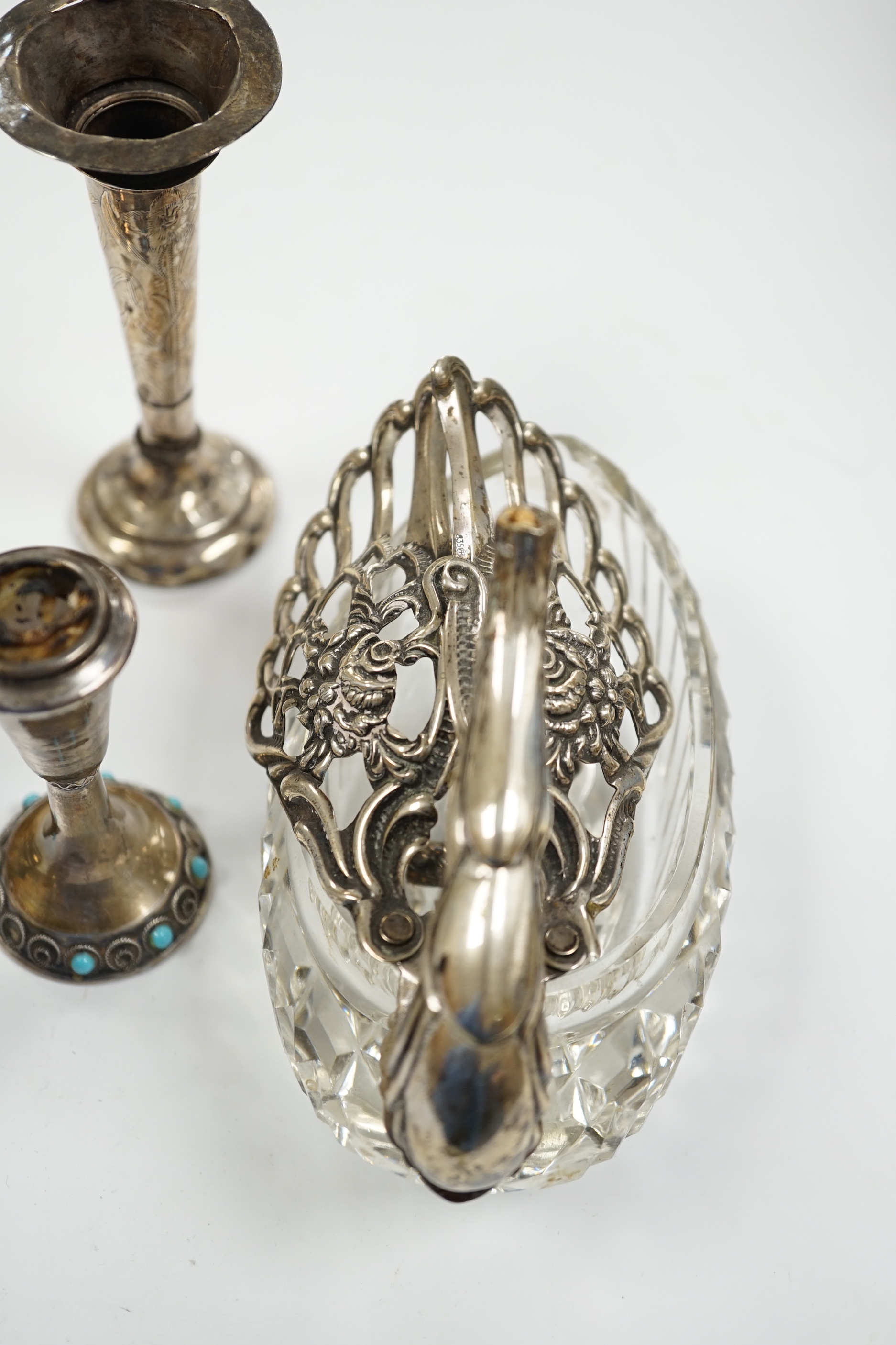 Two small white metal candlesticks, 8cm, an Indian vase, silver posy vase and a white metal mounted glass swan dish, a.f.